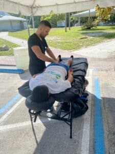 HH therapist Mike giving post-event massage at the Key Biscayne Lighthouse Run