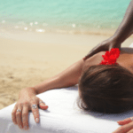 woman getting massage on the beach