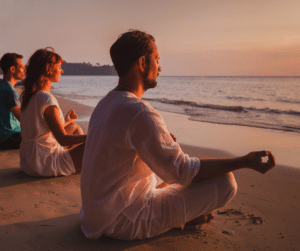 people meditating on the beach