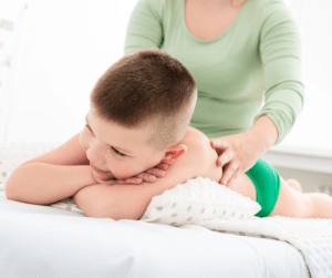 Little boy getting a massage