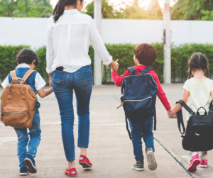 mom walking with kids to school