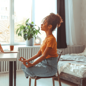 woman in lotus pose on a chair