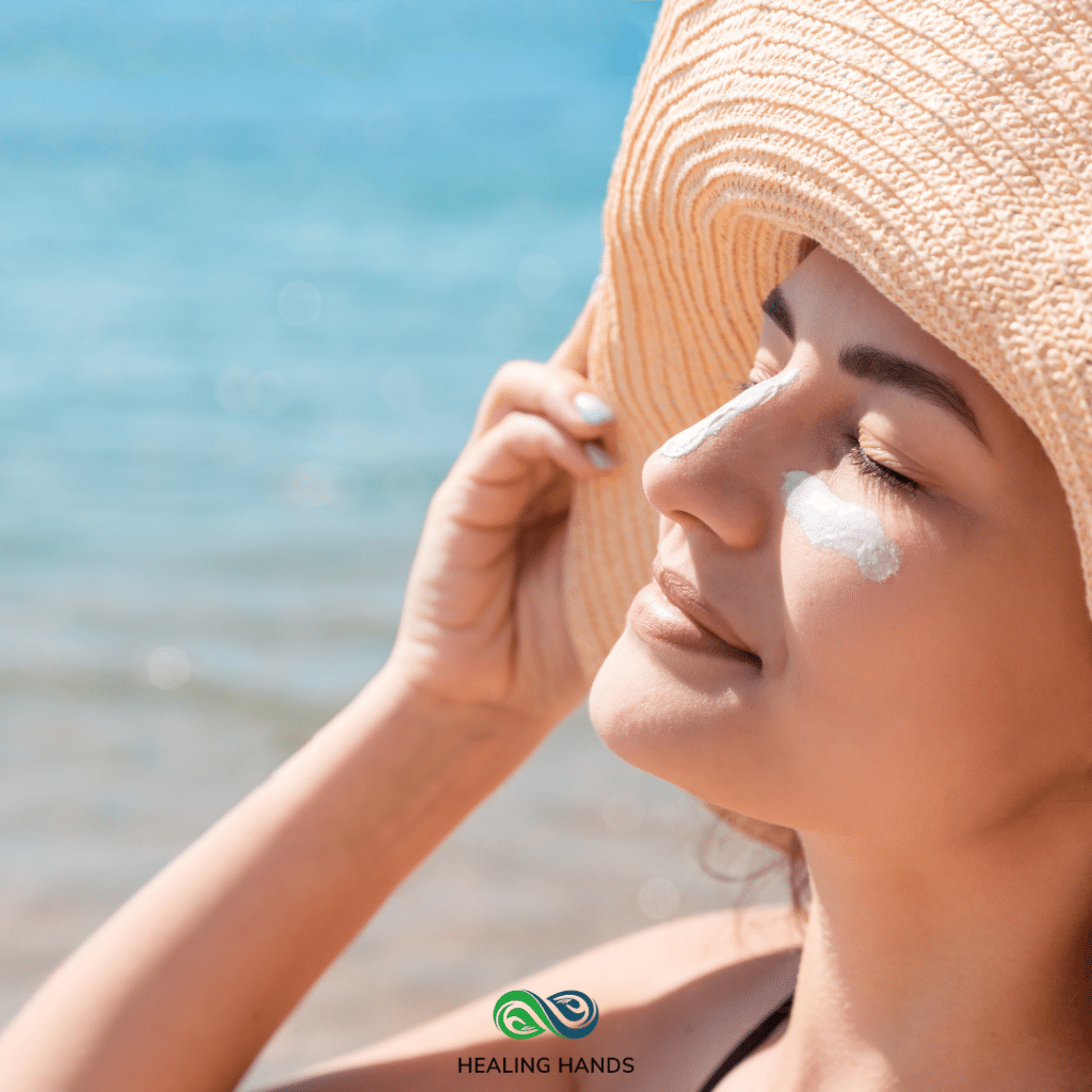 woman in a straw hat at the beach in the sun