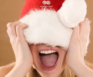 A woman shouting in a Santa hat