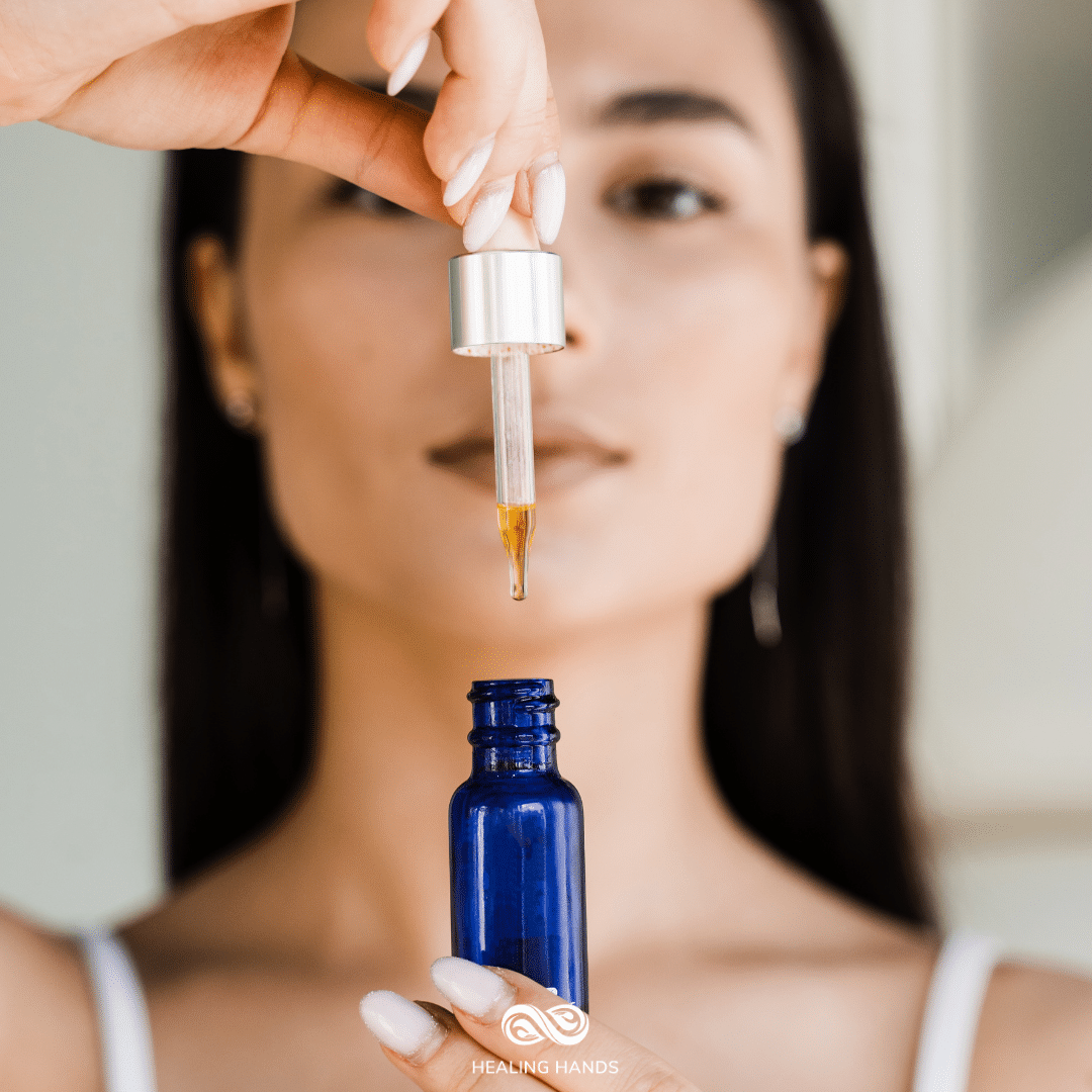 closeup of a woman with a bottle of facial serum