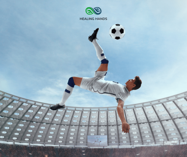 man kicking soccer ball